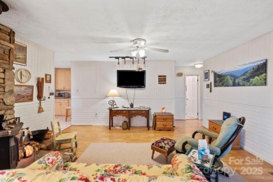 Where charm meets ideal location, this 3/2 with bonus rooms on Black Mountain Golf Course in North Carolina - for sale on GolfHomes.com, golf home, golf lot