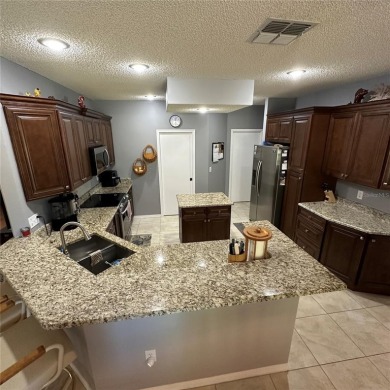 Beautiful St. Thomas model which has 2+den and 2 bath a  single on Caloosa Greens Executive Golf Course in Florida - for sale on GolfHomes.com, golf home, golf lot