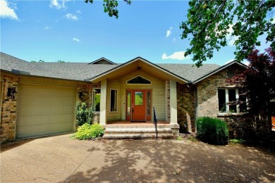 Welcome to your dream home in the heart of the Ozarks! Nestled on Holiday Island Executive Golf Course in Arkansas - for sale on GolfHomes.com, golf home, golf lot