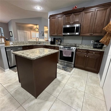 Beautiful St. Thomas model which has 2+den and 2 bath a  single on Caloosa Greens Executive Golf Course in Florida - for sale on GolfHomes.com, golf home, golf lot