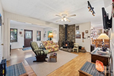 Where charm meets ideal location, this 3/2 with bonus rooms on Black Mountain Golf Course in North Carolina - for sale on GolfHomes.com, golf home, golf lot