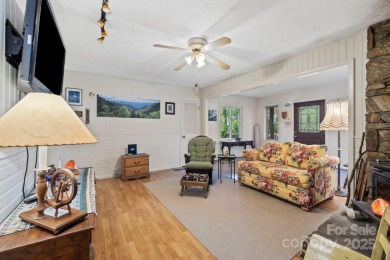 Where charm meets ideal location, this 3/2 with bonus rooms on Black Mountain Golf Course in North Carolina - for sale on GolfHomes.com, golf home, golf lot