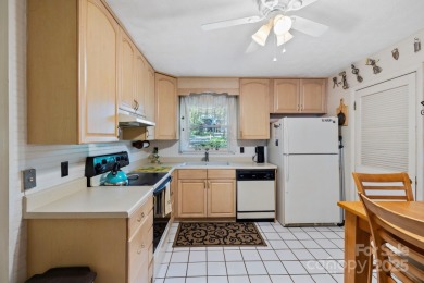 Where charm meets ideal location, this 3/2 with bonus rooms on Black Mountain Golf Course in North Carolina - for sale on GolfHomes.com, golf home, golf lot