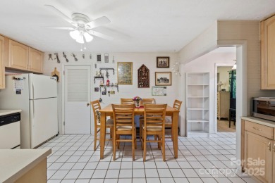 Where charm meets ideal location, this 3/2 with bonus rooms on Black Mountain Golf Course in North Carolina - for sale on GolfHomes.com, golf home, golf lot