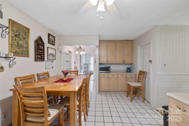 Where charm meets ideal location, this 3/2 with bonus rooms on Black Mountain Golf Course in North Carolina - for sale on GolfHomes.com, golf home, golf lot