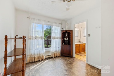 Where charm meets ideal location, this 3/2 with bonus rooms on Black Mountain Golf Course in North Carolina - for sale on GolfHomes.com, golf home, golf lot