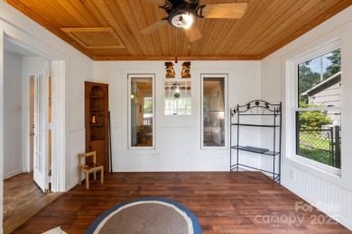 Where charm meets ideal location, this 3/2 with bonus rooms on Black Mountain Golf Course in North Carolina - for sale on GolfHomes.com, golf home, golf lot