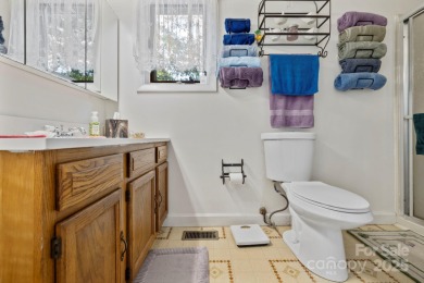 Where charm meets ideal location, this 3/2 with bonus rooms on Black Mountain Golf Course in North Carolina - for sale on GolfHomes.com, golf home, golf lot