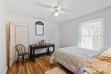 Where charm meets ideal location, this 3/2 with bonus rooms on Black Mountain Golf Course in North Carolina - for sale on GolfHomes.com, golf home, golf lot