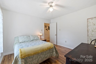 Where charm meets ideal location, this 3/2 with bonus rooms on Black Mountain Golf Course in North Carolina - for sale on GolfHomes.com, golf home, golf lot