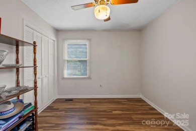 Where charm meets ideal location, this 3/2 with bonus rooms on Black Mountain Golf Course in North Carolina - for sale on GolfHomes.com, golf home, golf lot