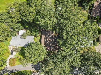 Where charm meets ideal location, this 3/2 with bonus rooms on Black Mountain Golf Course in North Carolina - for sale on GolfHomes.com, golf home, golf lot