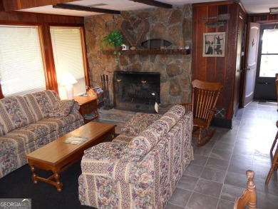 Escape the heat and enjoy cool mountain living in this furnished on Sky Valley Resort and Country Club in Georgia - for sale on GolfHomes.com, golf home, golf lot