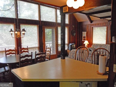 Escape the heat and enjoy cool mountain living in this furnished on Sky Valley Resort and Country Club in Georgia - for sale on GolfHomes.com, golf home, golf lot