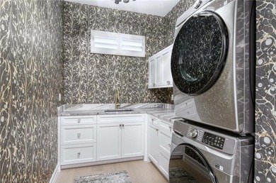 Nestled within the prestigious Pelican Marsh, this recently on Pelican Marsh Golf Club in Florida - for sale on GolfHomes.com, golf home, golf lot