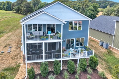 Enjoy this beautifully built home, nestled inside a quiet, gated on The Waterfront Country Club in Virginia - for sale on GolfHomes.com, golf home, golf lot