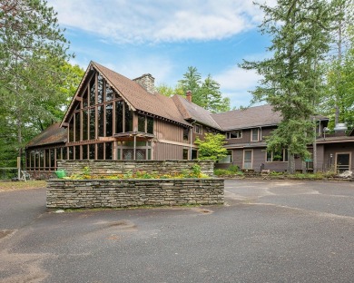 The nostalgic 3 season main lodge at the Froelich's Sayner Lodge on Plum Lake Golf Club in Wisconsin - for sale on GolfHomes.com, golf home, golf lot