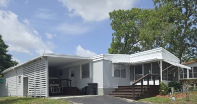This beautifully maintained home exudes warmth and comfort from on Rolling Greens Executive Golf Community in Florida - for sale on GolfHomes.com, golf home, golf lot