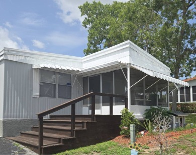 This beautifully maintained home exudes warmth and comfort from on Rolling Greens Executive Golf Community in Florida - for sale on GolfHomes.com, golf home, golf lot