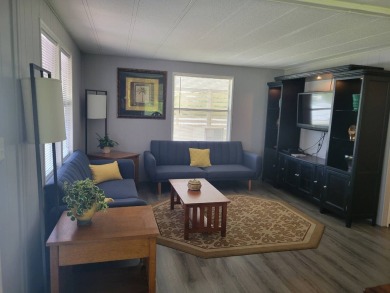 This beautifully maintained home exudes warmth and comfort from on Rolling Greens Executive Golf Community in Florida - for sale on GolfHomes.com, golf home, golf lot