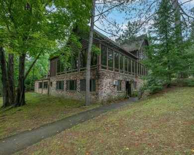 The nostalgic 3 season main lodge at the Froelich's Sayner Lodge on Plum Lake Golf Club in Wisconsin - for sale on GolfHomes.com, golf home, golf lot