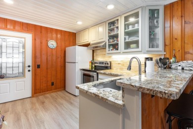 This charming 3-bedroom, 2.5-bath coastal retreat is located on Beachwood Golf Club in South Carolina - for sale on GolfHomes.com, golf home, golf lot
