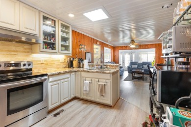 This charming 3-bedroom, 2.5-bath coastal retreat is located on Beachwood Golf Club in South Carolina - for sale on GolfHomes.com, golf home, golf lot