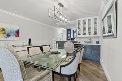 EXQUISITE 1ST FLOOR CORNER IN SOUGHT AFTER ARUBA VILLAGE ON THE on Wynmoor Golf Course in Florida - for sale on GolfHomes.com, golf home, golf lot