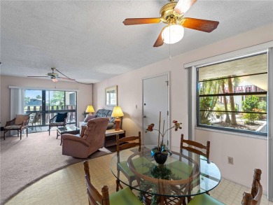 Peaceful water views, two pools, and access to kayak storage on Rotonda Golf and Country Club The Hills Course in Florida - for sale on GolfHomes.com, golf home, golf lot