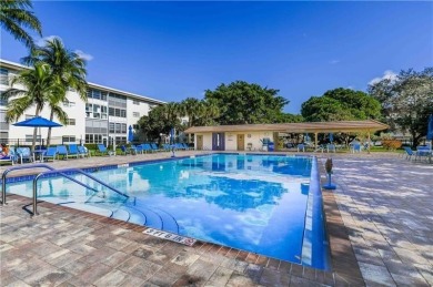 EXQUISITE 1ST FLOOR CORNER IN SOUGHT AFTER ARUBA VILLAGE ON THE on Wynmoor Golf Course in Florida - for sale on GolfHomes.com, golf home, golf lot