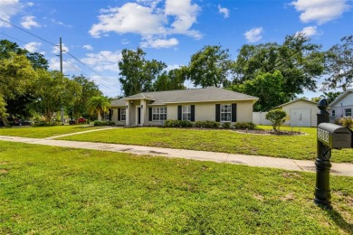 This home is located in the Forest Hills area of Tampa.  It is on Babe Zaharias Golf Course in Florida - for sale on GolfHomes.com, golf home, golf lot