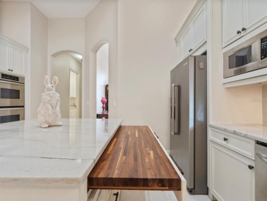This stunning 4-bedroom, 3-bath pool home overlooking the 16th on DeBary Golf and Country Club in Florida - for sale on GolfHomes.com, golf home, golf lot