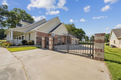Gated, golf cart to the country club, and just steps from Cedar on Cedar Creek Country Club in Texas - for sale on GolfHomes.com, golf home, golf lot