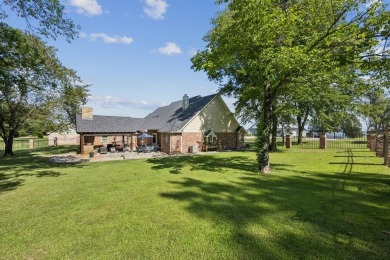 Gated, golf cart to the country club, and just steps from Cedar on Cedar Creek Country Club in Texas - for sale on GolfHomes.com, golf home, golf lot