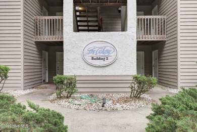 Nestled in the heart of Sunset Beach, this beautifully furnished on Oyster Bay Golf Links in North Carolina - for sale on GolfHomes.com, golf home, golf lot