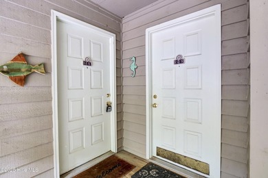 Nestled in the heart of Sunset Beach, this beautifully furnished on Oyster Bay Golf Links in North Carolina - for sale on GolfHomes.com, golf home, golf lot