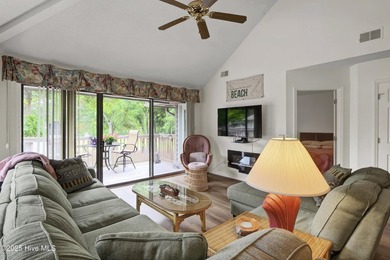 Nestled in the heart of Sunset Beach, this beautifully furnished on Oyster Bay Golf Links in North Carolina - for sale on GolfHomes.com, golf home, golf lot