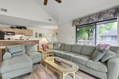 Nestled in the heart of Sunset Beach, this beautifully furnished on Oyster Bay Golf Links in North Carolina - for sale on GolfHomes.com, golf home, golf lot