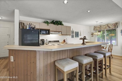 Nestled in the heart of Sunset Beach, this beautifully furnished on Oyster Bay Golf Links in North Carolina - for sale on GolfHomes.com, golf home, golf lot