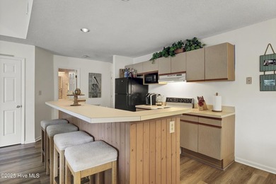 Nestled in the heart of Sunset Beach, this beautifully furnished on Oyster Bay Golf Links in North Carolina - for sale on GolfHomes.com, golf home, golf lot