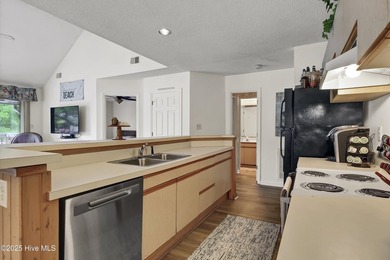 Nestled in the heart of Sunset Beach, this beautifully furnished on Oyster Bay Golf Links in North Carolina - for sale on GolfHomes.com, golf home, golf lot