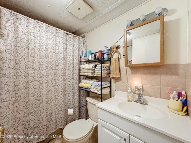 SNOWBIRDS OR HOMEOWNERS WELCOME- YOU OWN the land. 2 Bedroom on Glen Lakes Country Club in Florida - for sale on GolfHomes.com, golf home, golf lot