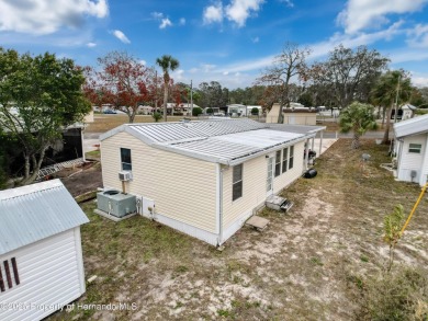 SNOWBIRDS OR HOMEOWNERS WELCOME- YOU OWN the land. 2 Bedroom on Glen Lakes Country Club in Florida - for sale on GolfHomes.com, golf home, golf lot