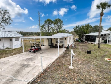 SNOWBIRDS OR HOMEOWNERS WELCOME- YOU OWN the land. 2 Bedroom on Glen Lakes Country Club in Florida - for sale on GolfHomes.com, golf home, golf lot