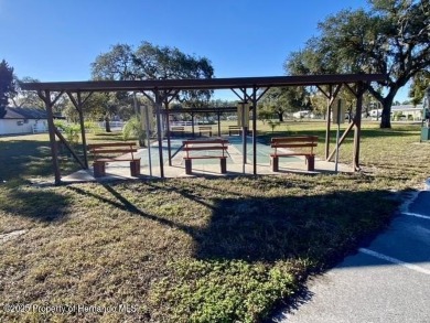 SNOWBIRDS OR HOMEOWNERS WELCOME- YOU OWN the land. 2 Bedroom on Glen Lakes Country Club in Florida - for sale on GolfHomes.com, golf home, golf lot