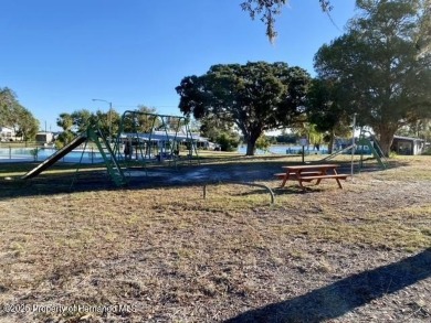 SNOWBIRDS OR HOMEOWNERS WELCOME- YOU OWN the land. 2 Bedroom on Glen Lakes Country Club in Florida - for sale on GolfHomes.com, golf home, golf lot