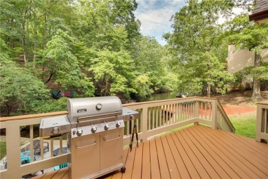 PRICE IMPROVEMENT - WATERFRONT RETREAT - located in the Lake on The Highlands Course at Lake Arrowhead in Georgia - for sale on GolfHomes.com, golf home, golf lot