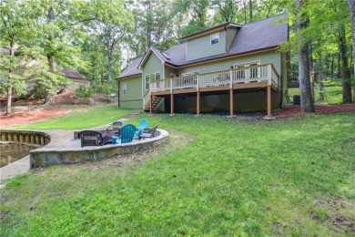 PRICE IMPROVEMENT - WATERFRONT RETREAT - located in the Lake on The Highlands Course at Lake Arrowhead in Georgia - for sale on GolfHomes.com, golf home, golf lot