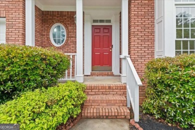 Welcome to this classic brick-front traditional southern home on Country Club of Gwinnett in Georgia - for sale on GolfHomes.com, golf home, golf lot