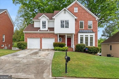 Welcome to this classic brick-front traditional southern home on Country Club of Gwinnett in Georgia - for sale on GolfHomes.com, golf home, golf lot